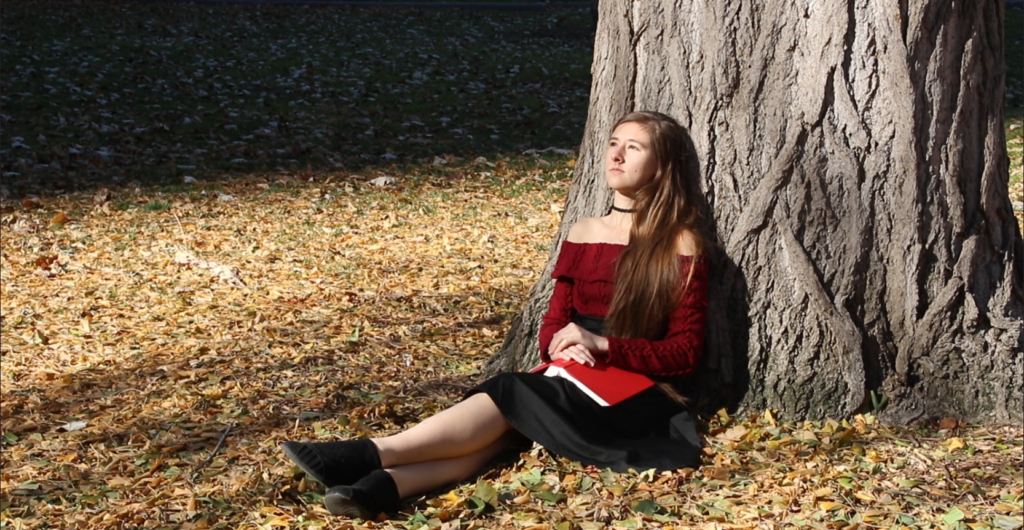 Kenzie Claire under an oak tree